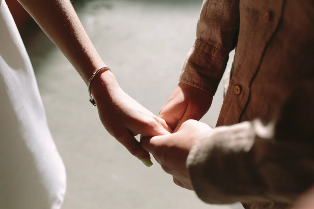 Couple holding hands